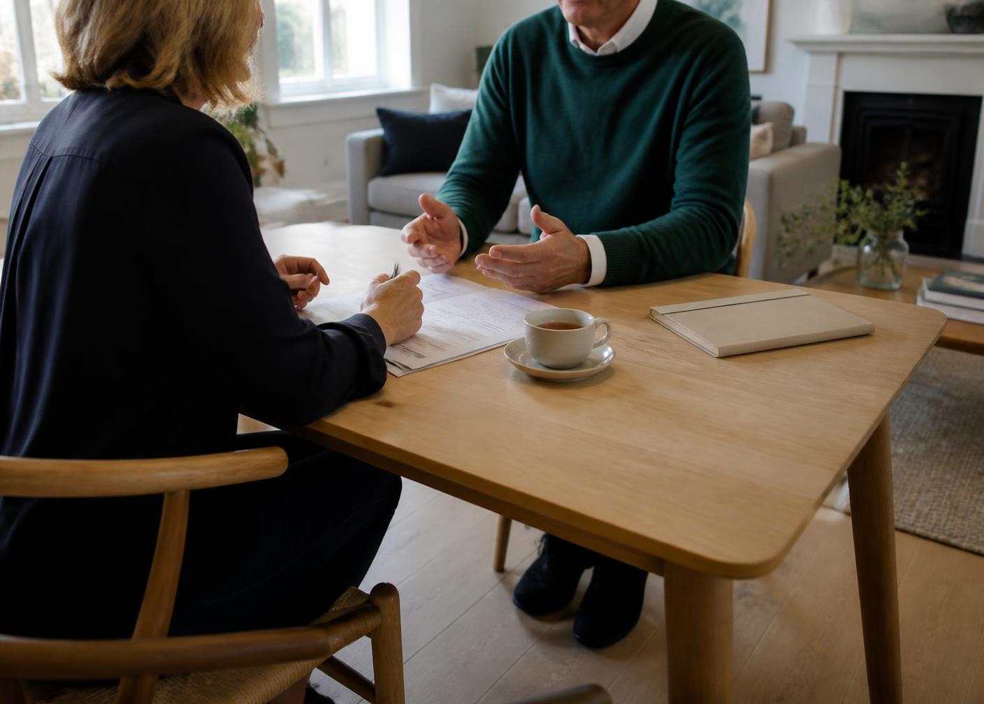 A calm, unhurried property conversation at a kitchen table